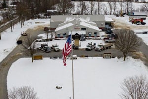 Front of building with delivery trucks